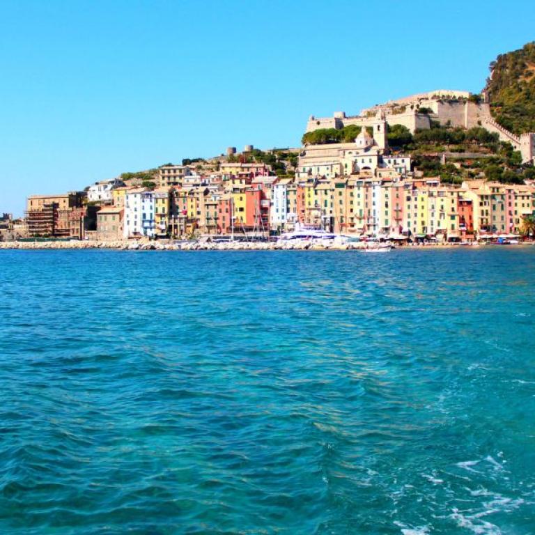 Panoramic sea view of Porto Venere with the historic village and fortress overlooking the turquoise Ligurian Sea