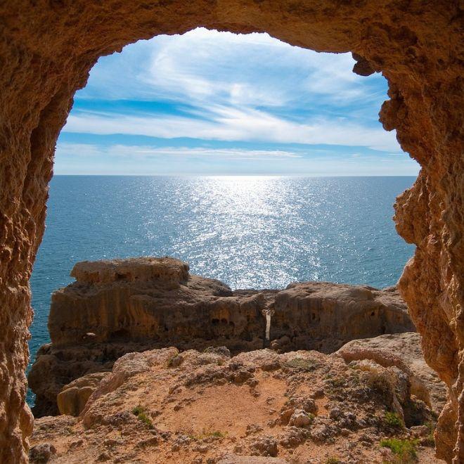 View of the sea through rocks in Portugal