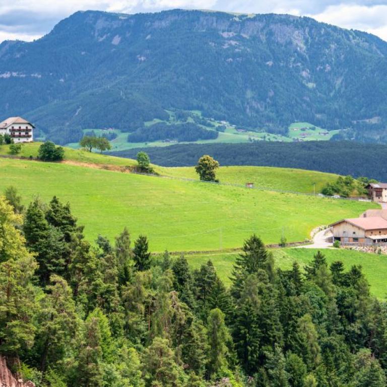Scenic village surrounded by forests and mountains along the Sentiero del Castagno in Alto Adige