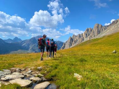 hikers walking in val maira