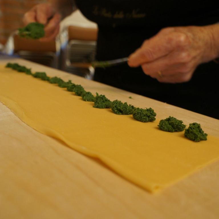 Traditional handmade pasta prepared in a local kitchen along the barolo walking trails journey.