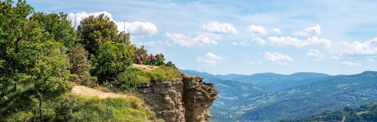 Panoramic cliff-top view along the Via degli Dei trail in the Apennine mountains