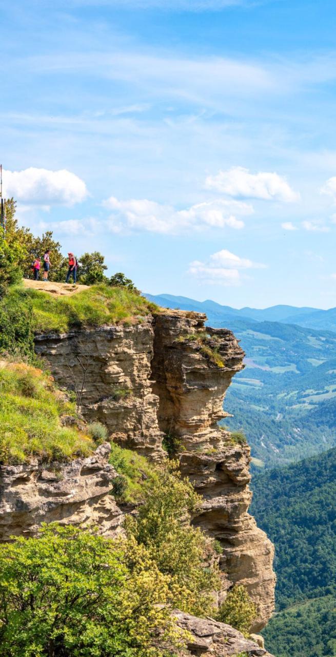 Panoramic cliff-top view along the Via degli Dei trail in the Apennine mountains
