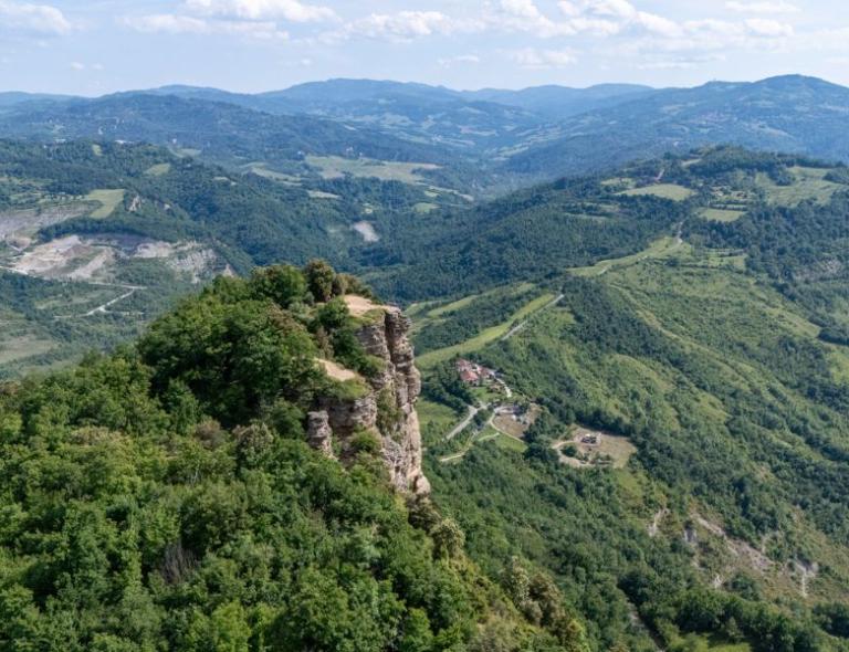 Aerial view of forested ridges and valleys along the Via degli Dei pilgrimage route