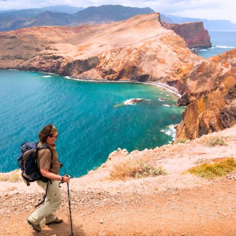 Hikers enjoying ocean views from coastal cliffs on a self-guided Madeira walking route