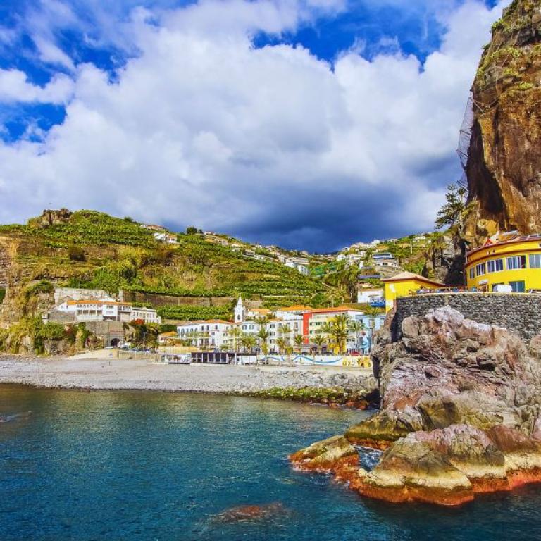 Traditional village and terraced fields overlooking the sea on the island of Madeira