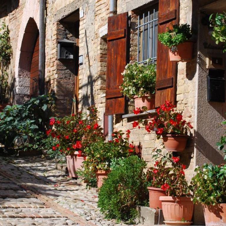 Tuscany umbria pictoresque street with flowers