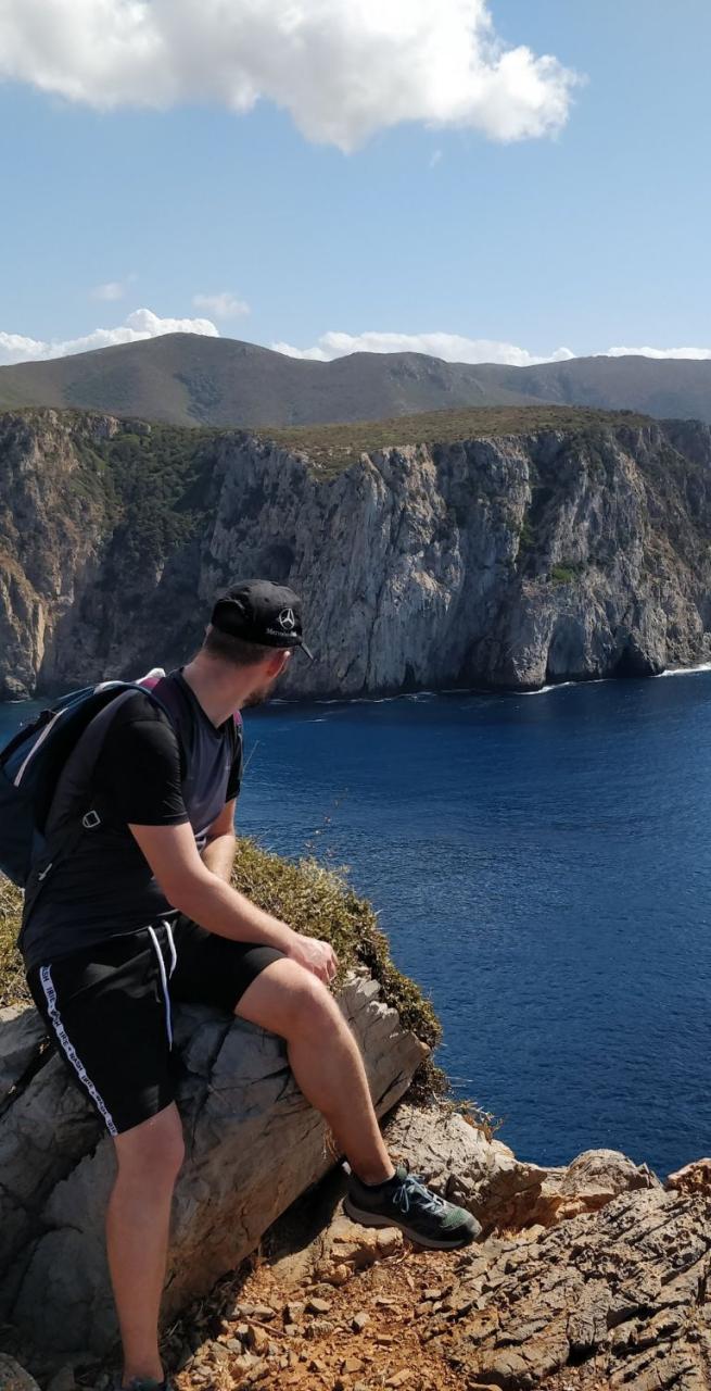 solo trip walker on cliff on sea