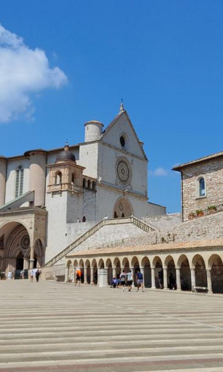 Lower square and Basilica of Saint Francis in Assisi, starting point of the St Francis pilgrimage easy version in Italy