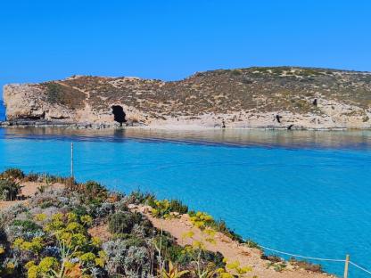 walking towards the pristine sea of malta